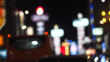 lurred City Nightlife: Neon Lights, Traffic, and Urban Glow