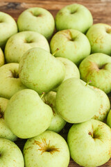 Freshly Picked Green Apples from Shandong China on Rustic Wood Background