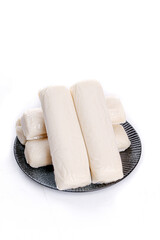 Traditional White Rice Cakes on Black Plate - Asian Food Ingredient