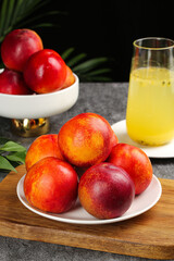 Fresh Red-Skinned Nectarines on Plate with Juice Glass - Healthy Summer Fruit Display