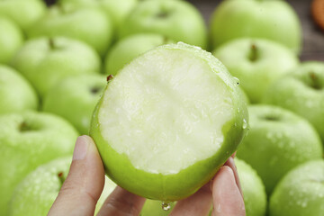 Fresh Green Apple Slice from Shaanxi China Showing Juicy White Flesh with Whole Apples in Background