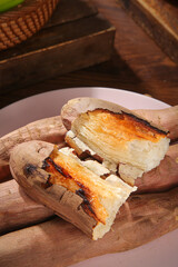 Roasted Sweet Potatoes from Shandong China on Wooden Plate Traditional Cooking Method