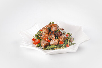 Beef Stir Fry with Vegetables and Mint on White Plate - Asian Cuisine Dish