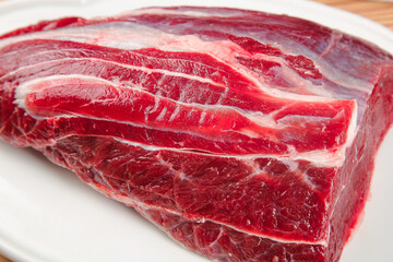 Fresh Raw Beef Cut with Marbling and Tendon on White Background