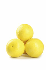 Fresh Golden Yellow Grapefruits Stacked on White Background - Healthy Citrus Fruit