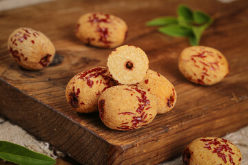 Fresh Red Jujube Dates on Wooden Board - Traditional Chinese Dried Fruit for Cooking and Health
