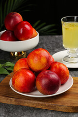 Fresh Red Yellow Nectarines Stone Fruit Healthy Organic Produce Display with Natural Juice Glass