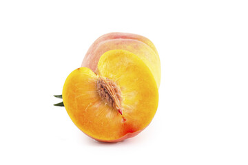 Fresh Cut Peach Halves with Yellow Flesh on White Background Studio Shot
