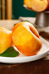 Fresh Cut Peach Slices with Golden Flesh on White Plate - Ripe Summer Fruit