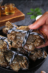 Fresh Yangcheng Lake Hairy Crabs Tied with Rope - Traditional Chinese Seafood Delicacy Closeup
