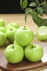 Fresh Green Apples with Water Drops on Wooden Board - Healthy Organic Fruit