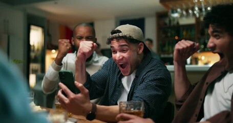 Winner, phone and fist pump with friends at pub for streaming game, sports score and goal. Team support, fans celebration and online results with people in bar for live broadcast and drinking beer