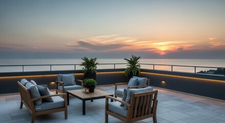 A rooftop terrace with modern wooden and cushioned outdoor furniture potted plants and linear lighting overlooking an ocean sunset