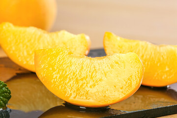 Fresh Orange Slices on Wooden Board with Golden Light and Vibrant Yellow Citrus Segments