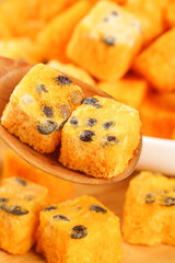 Freeze Dried Fruit Cake Blocks with Raisins on Wooden Spoon - Instant Tea Snacks