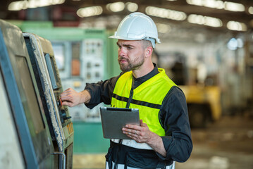 One man professional engineer worker technician checking old machine construction factory for...