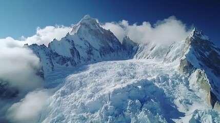 Stunning view of a massive snow-capped mountain peak towering over a frozen glacier