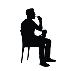 A black silhouette of a person sitting on a chair, enjoying a snack of french fries. This image represents casual dining, fast food, and a relaxed moment of eating.