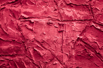 dark crimson  background, in the photo the texture of a gray wall with various lines, strokes and cracks