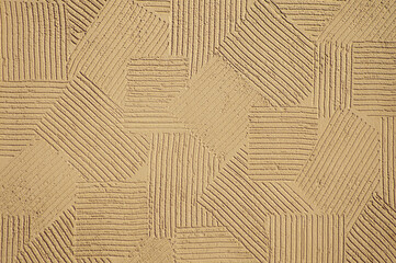 brown background, photo shows texture of decorative plaster