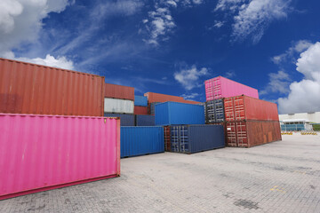 The containers are stacked in distribution warehouse.Export logistics shipping transportation concept
