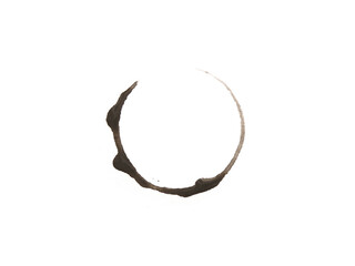 Messy circle from black coffee. A dark beverage stain forms a circular print with irregular details. Excellent for use as a background element or design overlay.