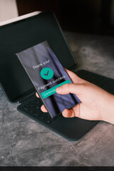 Online shopping concept. Woman use smartphone to pay online purchase. Secure payment on internet. Payment success on screen. Selective focus.