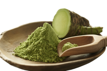 Freshly ground green wasabi powder on a wooden plate with a scoop and the raw rhizome, isolated on white for Japanese cuisine themes.