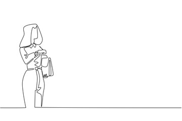 continuous line drawing of a young businesswoman holding a handbag and checking her watch, themed for National Punctuality Day to represent professionalism and effective time management