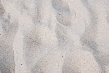 Beautiful sand in the summer day. Sand on the beach near a sea.