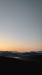 Obraz premium mMajestic mountain sunrise with mist and forest