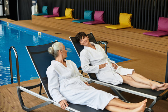 Wellness retreat for active senior women relaxing together in a soothing spa - Powered by Adobe