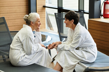 Beautiful mature women enjoying relaxation at a wellness center spa together
