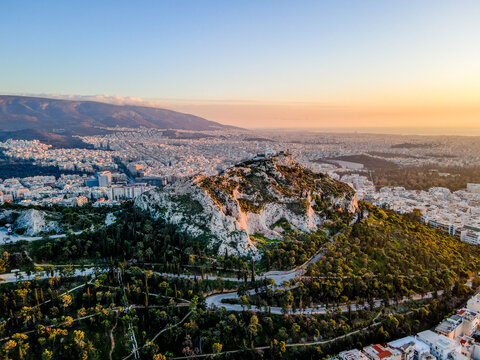 Aerial landscape from ancient Lycabettus Hill monument winter sunset Mediterranean Athens