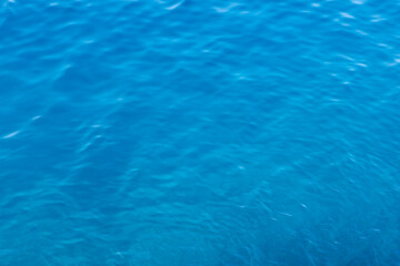 Wavy sea surface. Marine blue background. Copy space.