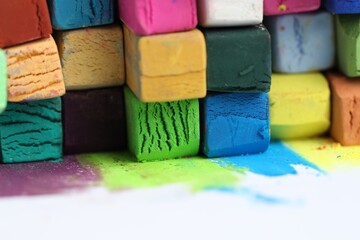 Many colorful chalk pastels on white background, closeup