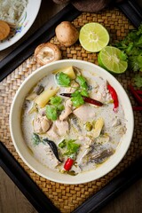 Tom kha gai ,Thai chicken coconut milk soup on white bowl ,top view ,It is Thai food, curry with coconut milk.	