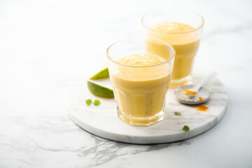 Healthy mango lassi with turmeric