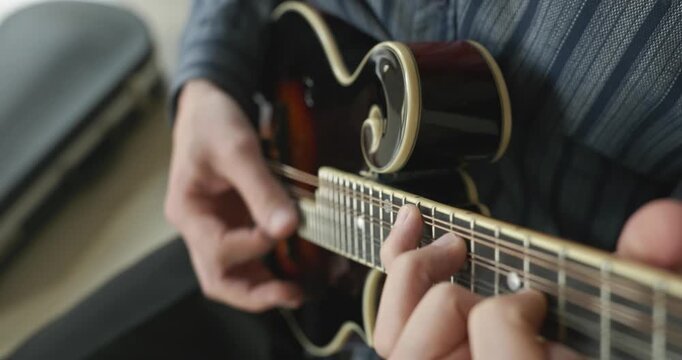 Male Musician Plays Mandolin. Caucasian Man Enjoys Playing Music 4K 10-bit
