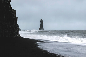 Balast columns on black sand beach in Iceland