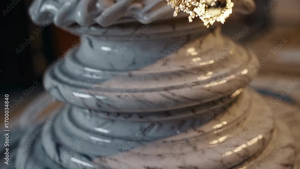 Poster close-up video of ornate marble architecture, showcasing intricate carvings and smooth textures from