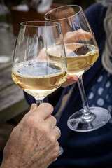 A celebratory toast with white wine