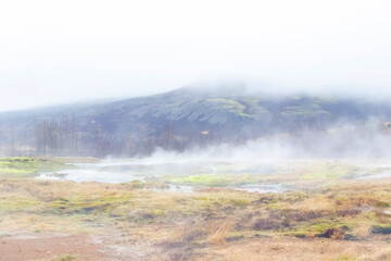 Geothermal steam landscape in Haukadalur, Iceland.