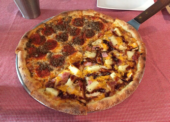Half Pepperoni and Half Hawaiian Pizza on Tray