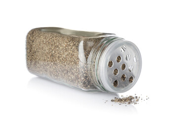 Ground black pepper in glass jar isolated on white. Aromatic spice