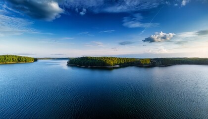Naklejka premium horizon over lake with strip of land separating sky and water horizon waterway calm