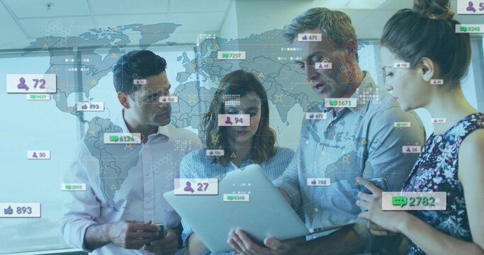 Four colleagues analyzing metrics on laptop in meeting room, with world map, floating social icons
