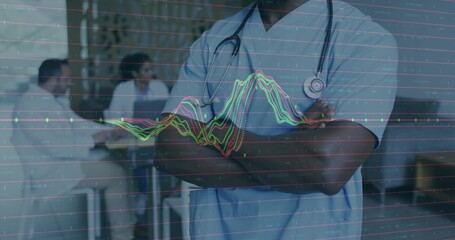Standing doctor in blue scrubs crossing arms in lounge, with stethoscope, digital graph overlay