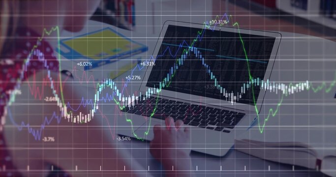 Female teen student analyzing stock market graphs in home study room, laptop, notebook, copy space