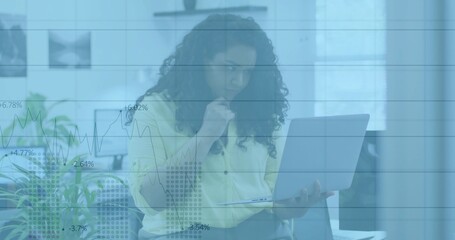 Analyzing market trends financial analyst holding laptop and pen in modern office, chart overlay